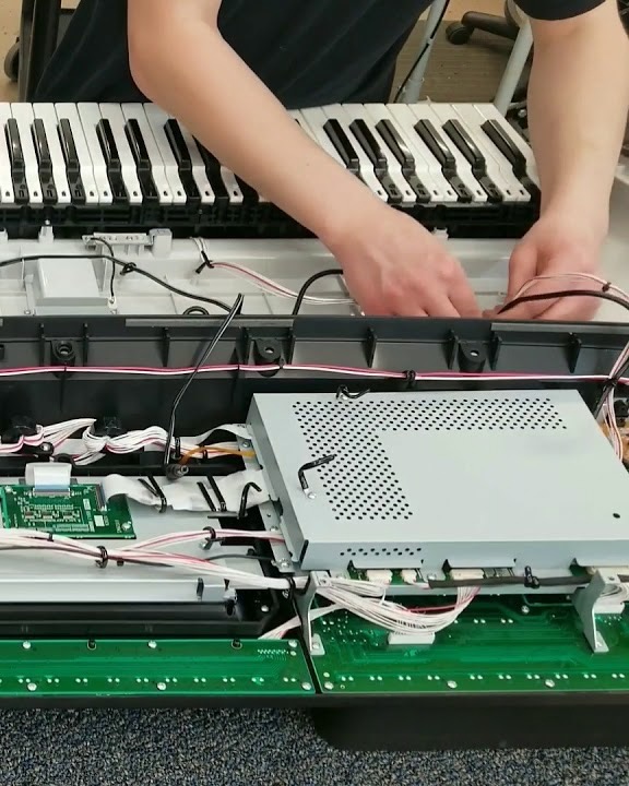 Repair being done on a disassembled keyboard